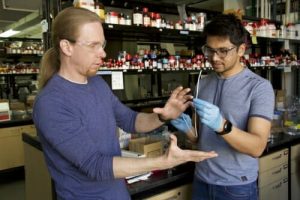 David Lynn and Harshit Agarwal standing in a lab